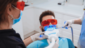 A young man recieving laser dental treatment in Fargo.